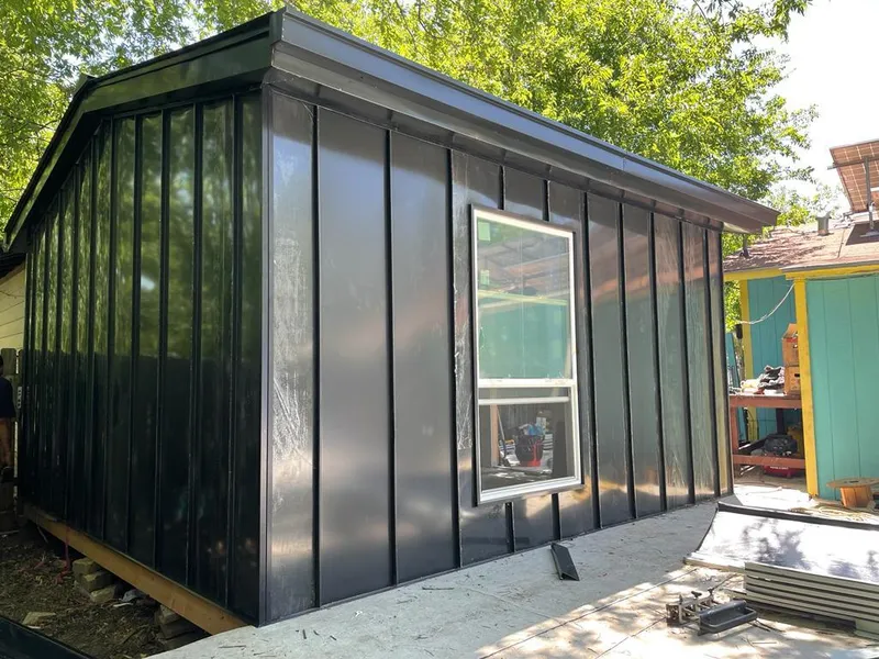 Black standing seam metal wall panels for Metal Roof Installation in Deschutes River Woods